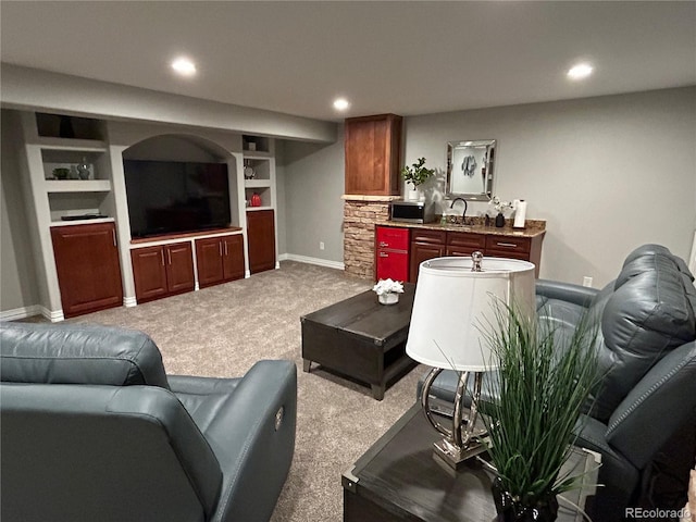 carpeted living room featuring built in features