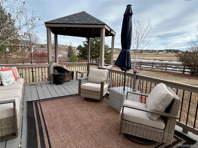 wooden deck featuring a gazebo