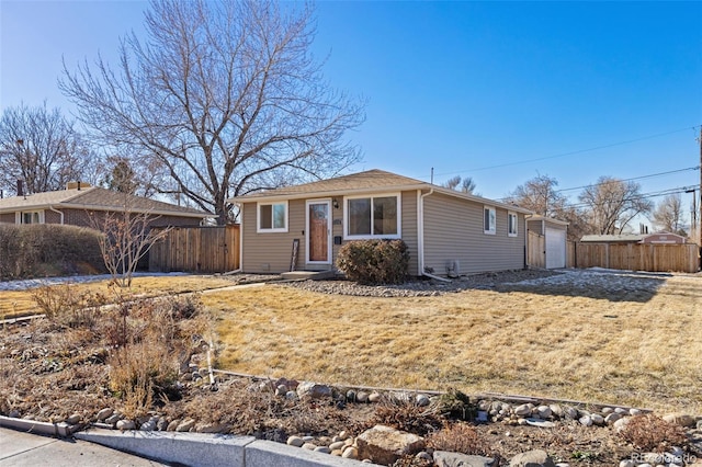 ranch-style house with a front yard and a garage