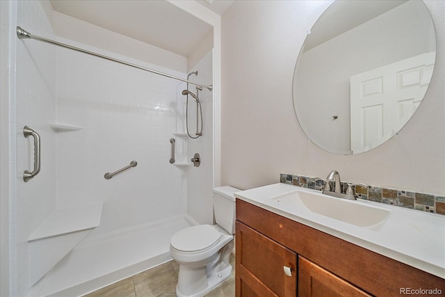 bathroom with walk in shower, vanity, and toilet