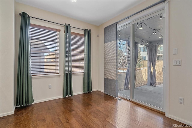 empty room with wood-type flooring