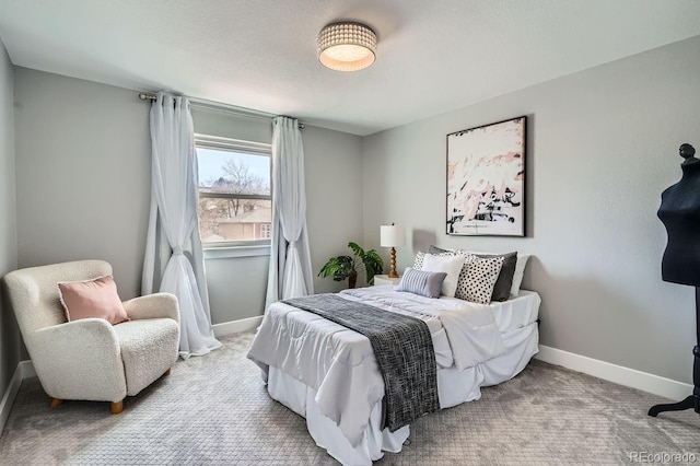 bedroom with carpet floors and baseboards