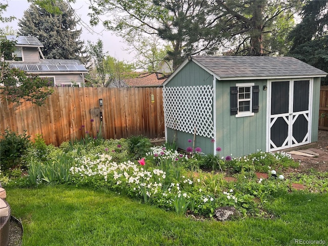 view of shed with fence