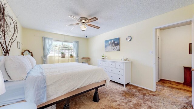 663 S Xenon Ct, Lakewood, CO 80228 - bedroom with a textured ceiling, light colored carpet, and ceiling fan