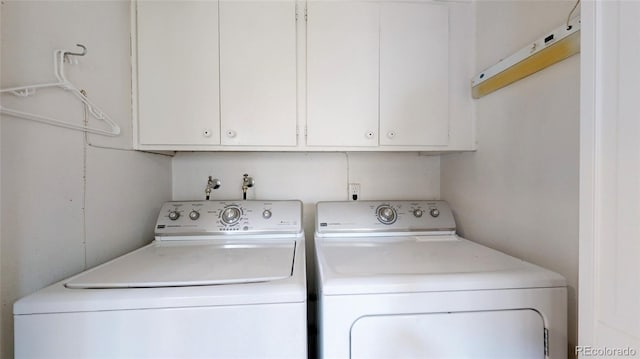 663 S Xenon Ct, Lakewood, CO 80228 - laundry area with washing machine and dryer and cabinet space