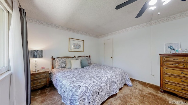 663 S Xenon Ct, Lakewood, CO 80228 - carpeted bedroom featuring a textured ceiling and ceiling fan