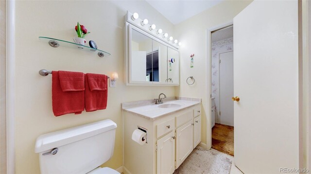 663 S Xenon Ct, Lakewood, CO 80228 - bathroom with toilet and vanity
