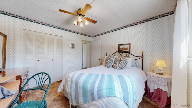 663 S Xenon Ct, Lakewood, CO 80228 - bedroom with carpet floors, a closet, wallpapered walls, and a ceiling fan