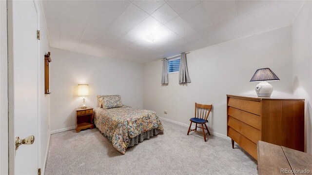 663 S Xenon Ct, Lakewood, CO 80228 - bedroom featuring light carpet and baseboards