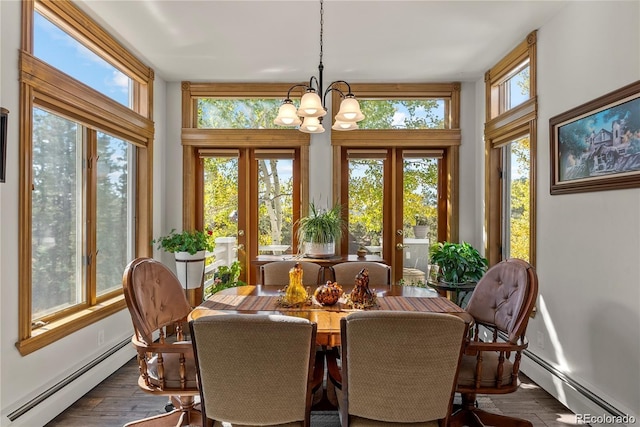 sunroom featuring a baseboard heating unit, french doors, and a notable chandelier