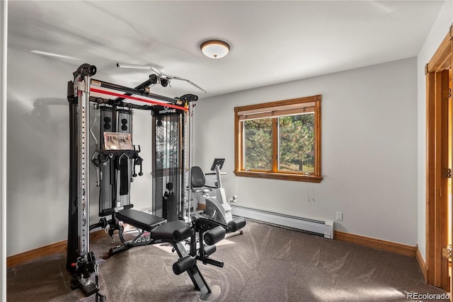 exercise room with carpet, baseboards, and baseboard heating