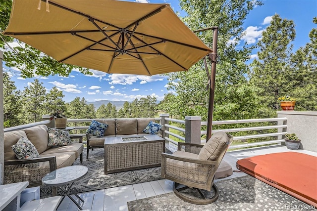 wooden deck with outdoor lounge area