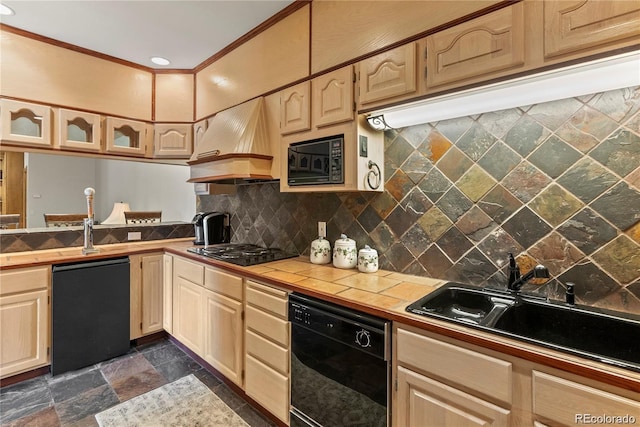 kitchen with crown molding, tile counters, custom range hood, stone finish floor, and black appliances