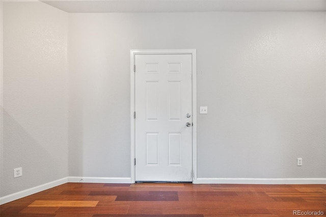 875 E 78th Ave Unit 9-2, Denver, CO 80229 - spare room with wood finished floors and baseboards