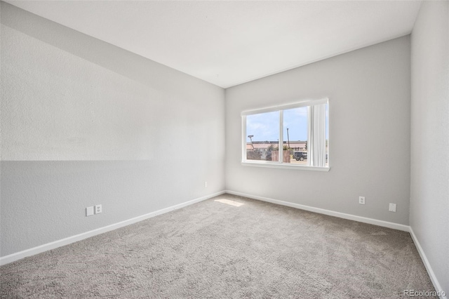 875 E 78th Ave Unit 9-2, Denver, CO 80229 - carpeted spare room featuring baseboards