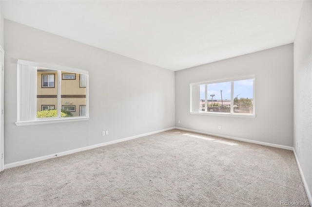 875 E 78th Ave Unit 9-2, Denver, CO 80229 - carpeted empty room with baseboards