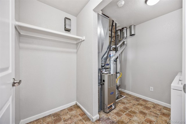 875 E 78th Ave Unit 9-2, Denver, CO 80229 - utility room featuring washer / clothes dryer