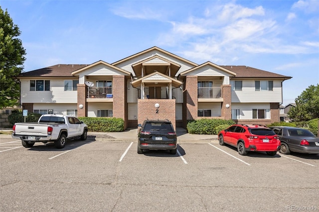 875 E 78th Ave Unit 9-2, Denver, CO 80229 - view of property with uncovered parking