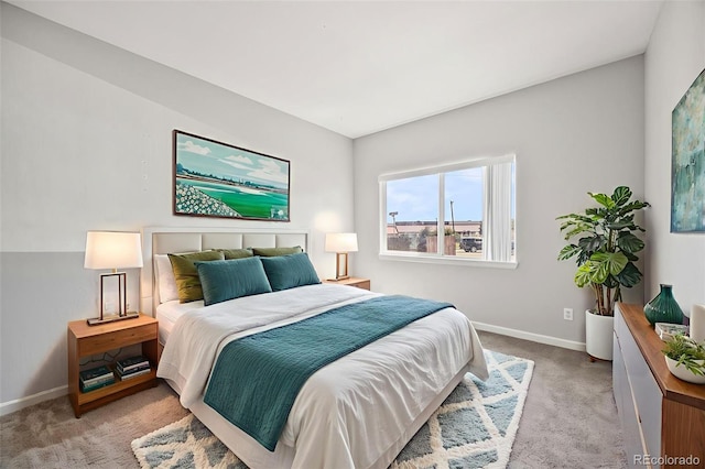 875 E 78th Ave Unit 9-2, Denver, CO 80229 - bedroom featuring light carpet and baseboards