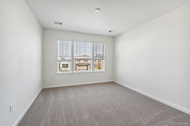 unfurnished room featuring carpet floors