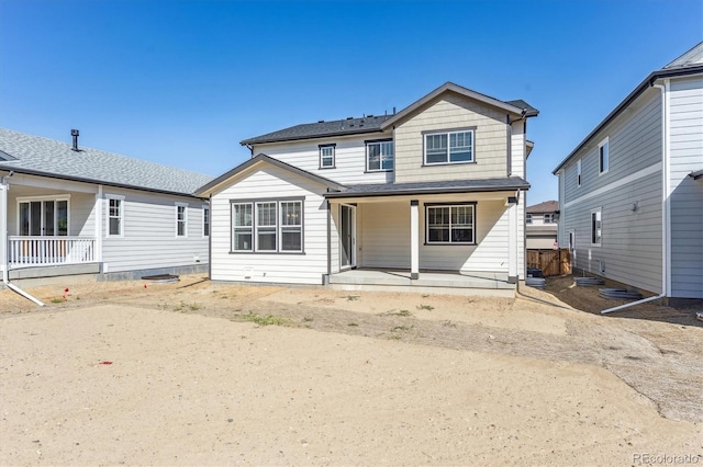 back of property featuring a porch