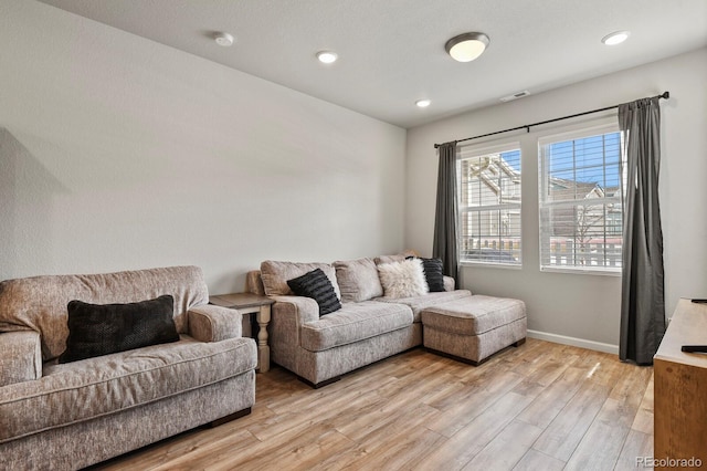 8765 Laurel Mountain Vw, Colorado Springs, CO 80924 - living area featuring light wood finished floors and recessed lighting