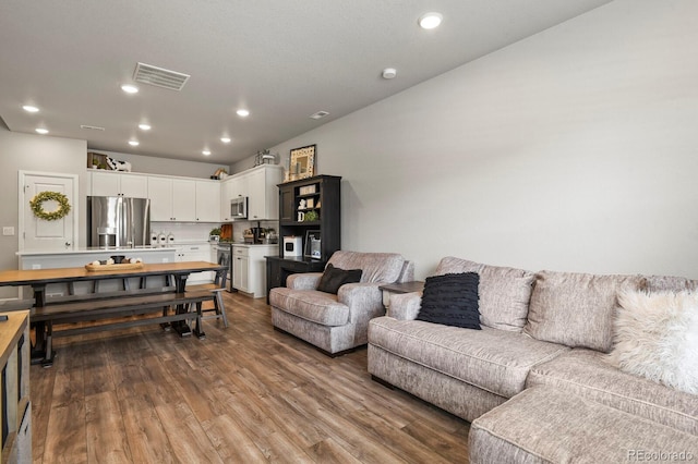 8765 Laurel Mountain Vw, Colorado Springs, CO 80924 - living room with dark wood-type flooring and recessed lighting