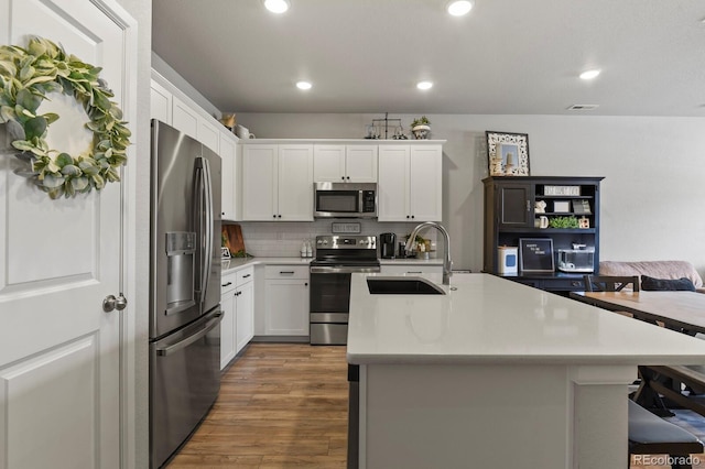 8765 Laurel Mountain Vw, Colorado Springs, CO 80924 - kitchen with appliances with stainless steel finishes, light countertops, dark wood-type flooring, white cabinets, and recessed lighting