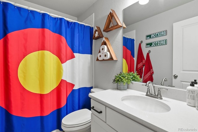 8765 Laurel Mountain Vw, Colorado Springs, CO 80924 - bathroom with vanity, a textured wall, and curtained shower