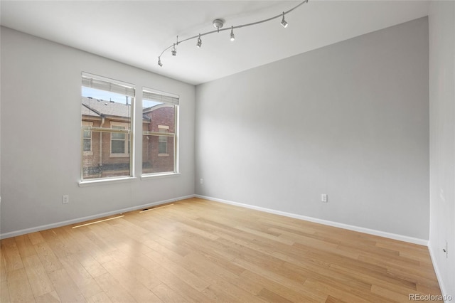 8987 E Otero Pl, Centennial, CO 80112 - empty room with light wood-style flooring and track lighting