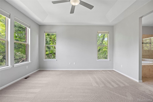 8987 E Otero Pl, Centennial, CO 80112 - unfurnished room with carpet flooring, ceiling fan, and a raised ceiling
