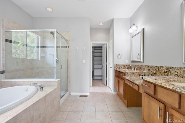 8987 E Otero Pl, Centennial, CO 80112 - bathroom featuring a shower stall, vanity, a bath, tile patterned flooring, and recessed lighting