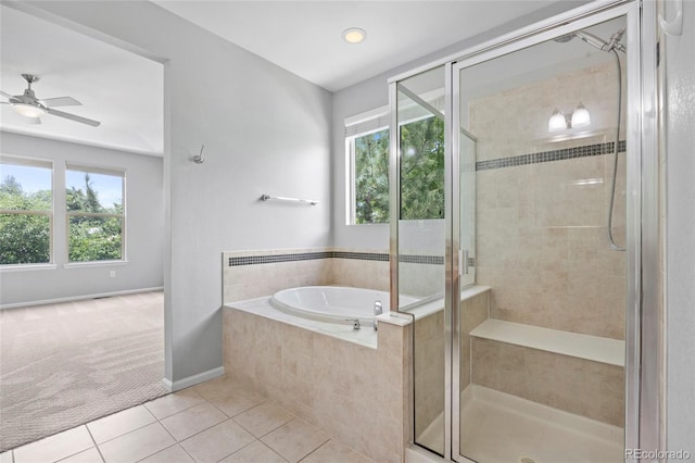 8987 E Otero Pl, Centennial, CO 80112 - full bath featuring a garden tub, tile patterned flooring, plenty of natural light, and a shower stall