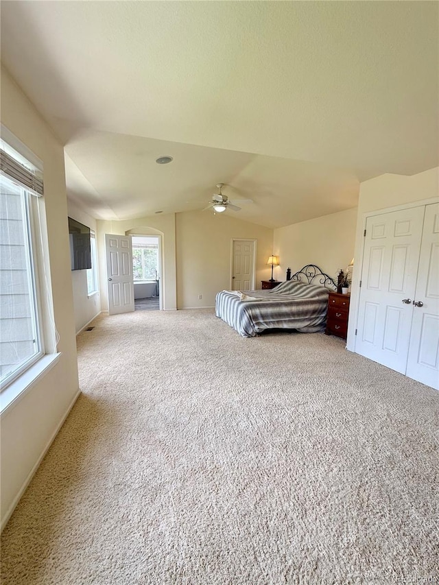 16063 E 106th Ct, Commerce City, CO 80022 - carpeted bedroom with vaulted ceiling, a ceiling fan, and baseboards