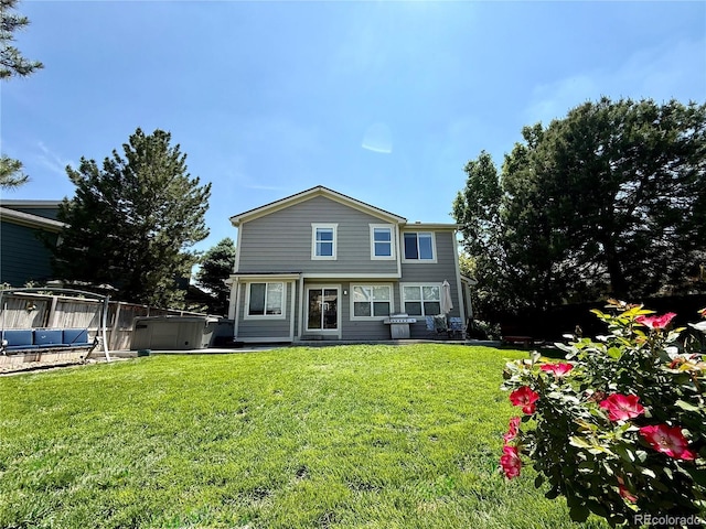 16063 E 106th Ct, Commerce City, CO 80022 - rear view of house with a lawn