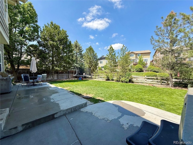 16063 E 106th Ct, Commerce City, CO 80022 - view of patio / terrace with a trampoline and a grill