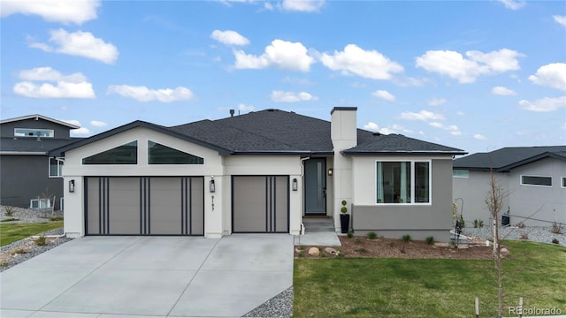 view of front of house with a front lawn and a garage