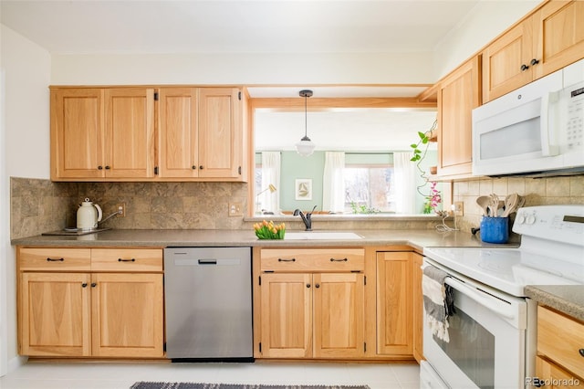 kitchen with white appliances, decorative backsplash, light brown cabinets, pendant lighting, and a sink