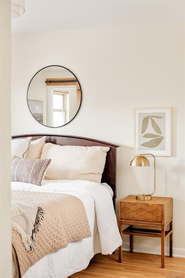 bedroom featuring wood finished floors