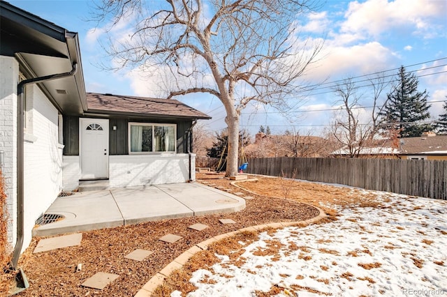 view of yard with a patio and fence