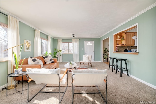 living room featuring ornamental molding, light carpet, and baseboards