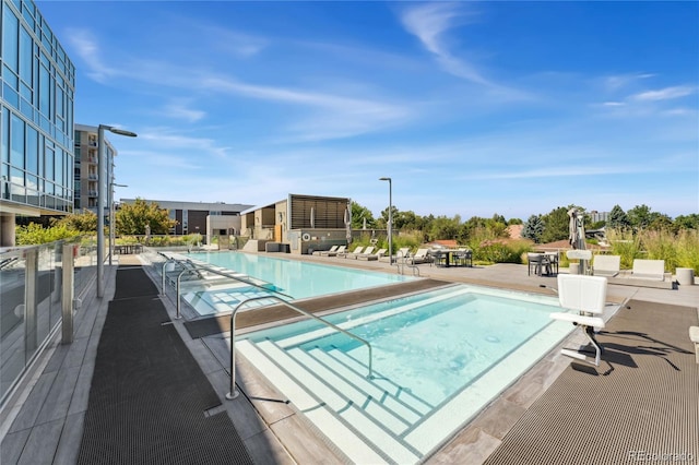 view of pool featuring a patio