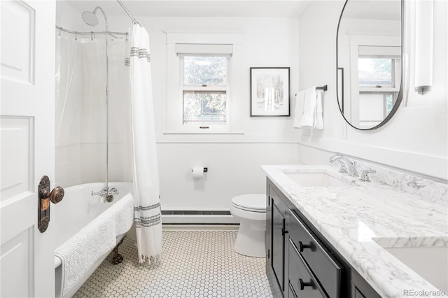 full bathroom with toilet, a sink, baseboard heating, shower / tub combo with curtain, and double vanity