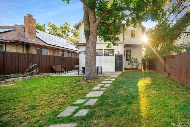 view of yard featuring a fenced backyard and a patio