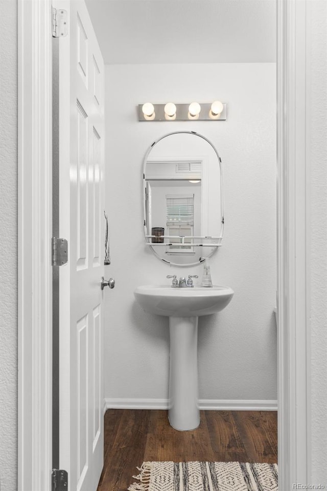 bathroom featuring wood-type flooring