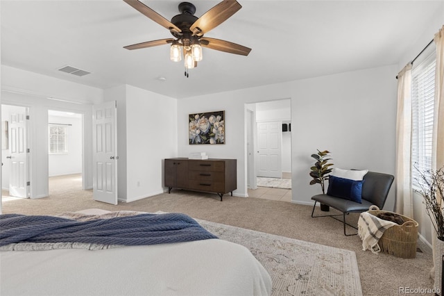 bedroom featuring light colored carpet and ceiling fan