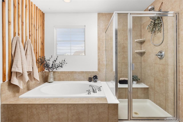 bathroom with separate shower and tub