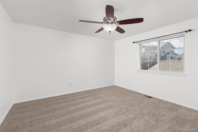 carpeted empty room with ceiling fan