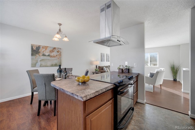 kitchen with island range hood, decorative light fixtures, black electric range oven, a chandelier, and a textured ceiling