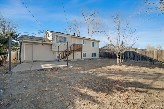 back of property with a patio